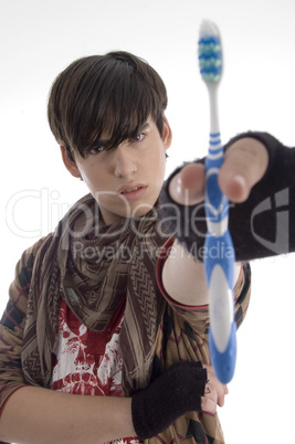 boy showing tooth brush