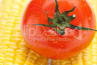 background of ripe yellow corn and tomato