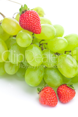 bunch of white grapes and strawberries isolated on white