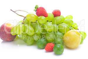 bunch of white grapes, peach and yellow plum isolated on white