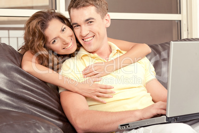 Mid adult couple with laptop