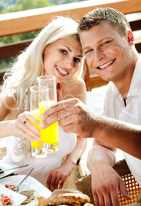 good morning - couple having juice smiling