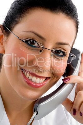 close view of pleased female doctor holding receiver