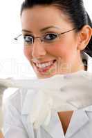 close view of smiling doctor wearing gloves and eyewear on white background