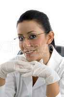 portrait of smiling doctor wearing hand gloves on white background