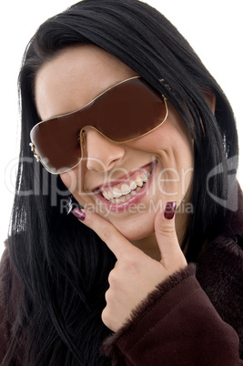 front view of pleased female wearing sunglasses on white background