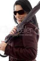 side view of female holding umbrella on white background