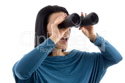 portrait of woman looking through binocular on white background