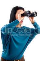 side pose of female looking through binocular on white background