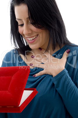 front view of surprised woman looking in jewellery box