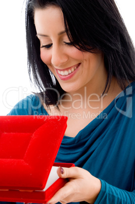 side pose of woman looking in jewellery box