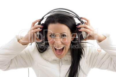 portrait of pleased woman holding headphone