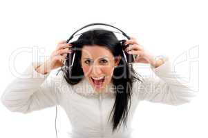 portrait of shouting woman enjoying music on white background