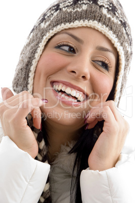 portrait of cheerful female with woolen cap