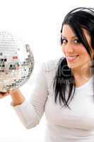 half length view of female listening music and carrying disco ball on white background