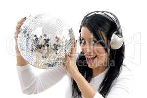 front view of happy woman holding disco ball