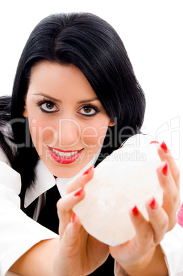 young woman holding rock in her hands