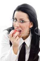 model wearing spectacles eating an apple