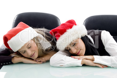 young corporate wearing christmas hat and sleeping