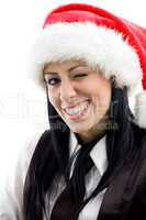 young female winking eyes and wearing christmas hat