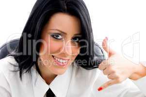 female showing telephonic hand gesture