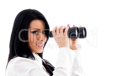female looking through binocular