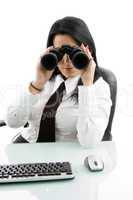 young manager looking through binocular