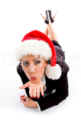 young employee with christmas hat giving flying kiss