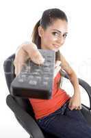 sitting girl showing remote