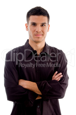 portrait of young executive standing with crossed arms