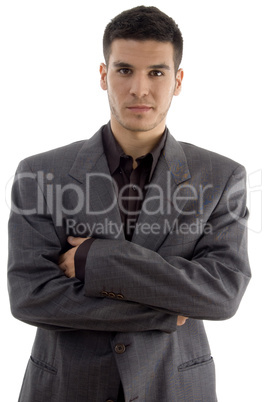portrait of young executive standing with crossed arms