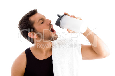 man taking refreshment while exercising