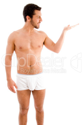 standing muscular man looking his palm