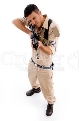 standing soldier pointing with gun