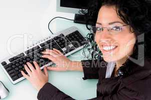 smiling female working on computer