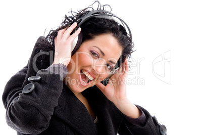 female enjoying music tract on headphone