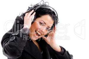 female enjoying music tract on headphone