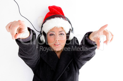 christmas hat wearing female pointing with both fingers