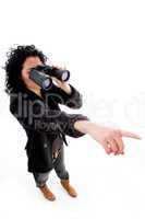 female pointing while looking through binocular