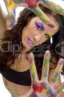 female model showing colorful hands