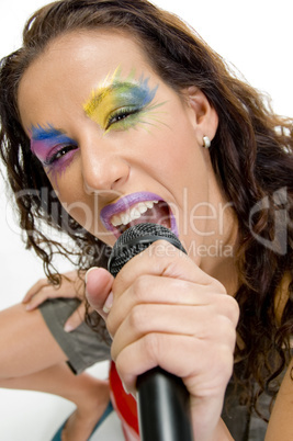 woman singing into microphone