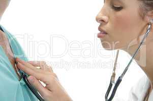 lady doctor examining the patient with stethoscope