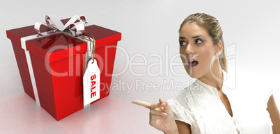surprised blonde woman pointing to gift