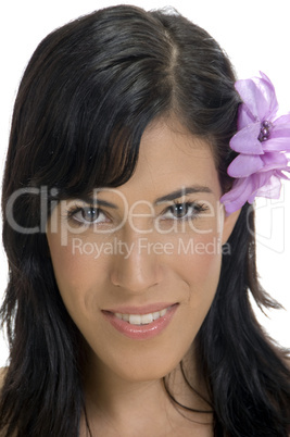 portrait of smiling woman with flower in her hair