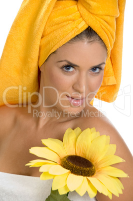 posing smiling sexy female in towel with sunflower