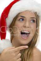 pointing sexy female with santa cap