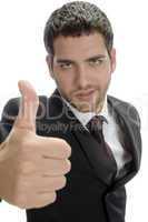 attractive businessman showing thumbs up