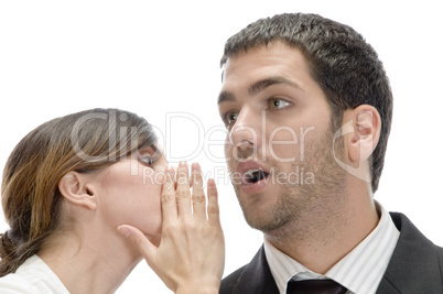 man and woman whispering sweet secrets