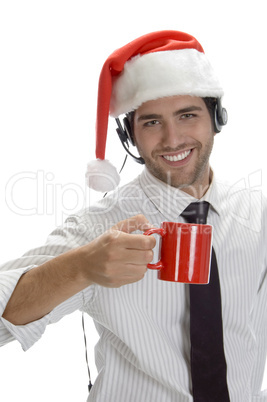 young man enjoying coffee and wearing santa cap