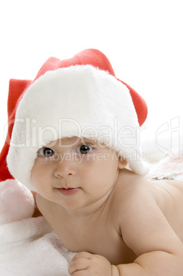 smiling toddler wearing red christmas cap